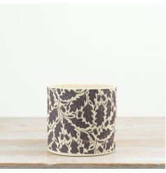 Add classic botanical charm to your collection with this stylish oak leaf print planter.