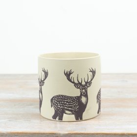 Cute terracotta pot shaped like a reindeer