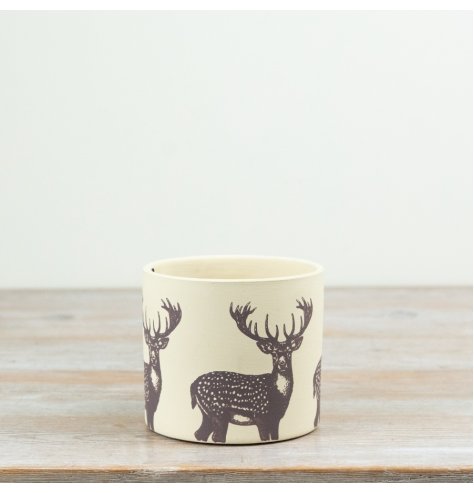 Add rustic charm with this stylish terracotta plant pot featuring a chic stag print—perfect for any space.