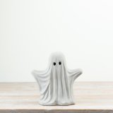 a charming standing ghost figurine 