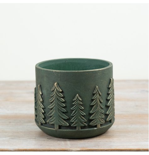 Add a touch of rustic charm with this forest green cement planter—perfect for woodland-inspired decor.