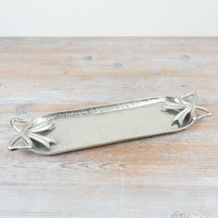 Enhance your space with the charm of this Silver Bow Candle Tray.