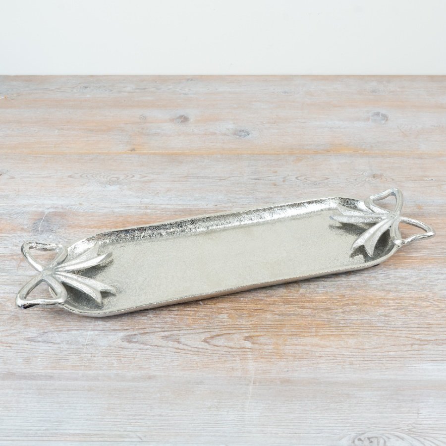 Enhance your space with the stylish Silver Bow Candle Tray.