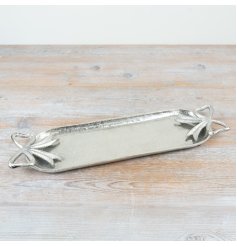 Enhance your space with the charm of this Silver Bow Candle Tray.