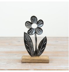 Elegant flower on base, crafted from durable aluminium and natural wood.
