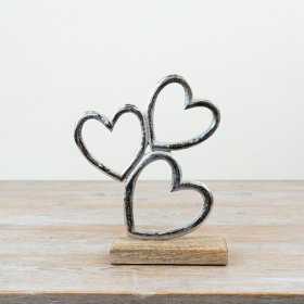 Bring modern charm to your space with the stylish Heart On Base accent piece.