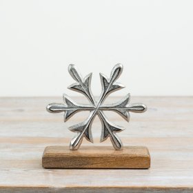 This striking aluminium snowflake decoration sits on a chunky mango wood base, 