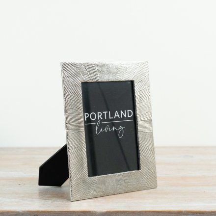 Elegant silver frame for photos with a sleek, modern design.
