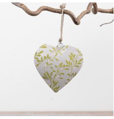 elegant glazed heart ornament with festive mistletoe design