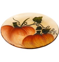 A stylish an unique glass plate with a homegrown pumpkin design, complete with beautiful trailing vines. 