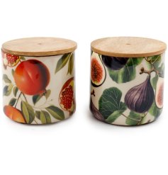 A mix of two beautifully printed storage jars, each with a richly coloured seasonal fruits photographic image. 