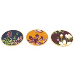 Richly coloured glass coasters, each with a beautiful floral design. 