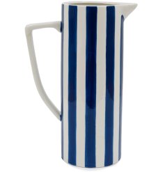 A bold and stylish jug with angular spout and handle. Complete with a hand finished blue stripe pattern. 
