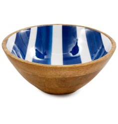 A beautifully crafted mango wood bowl with a bold blue and white stripe design. 