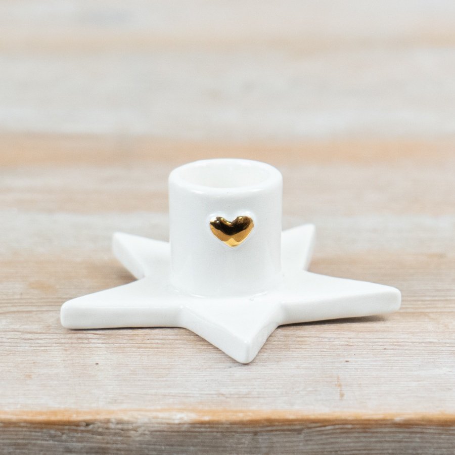Bring cozy charm to your space with this elegant heart-shaped Star Taper Candle Holder.