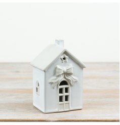 Illuminate your space with this charming, cordless LED house for a stylish and bright touch.