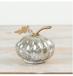 Make a bold impression with this glowing glass pumpkin—an essential standout for any decor.