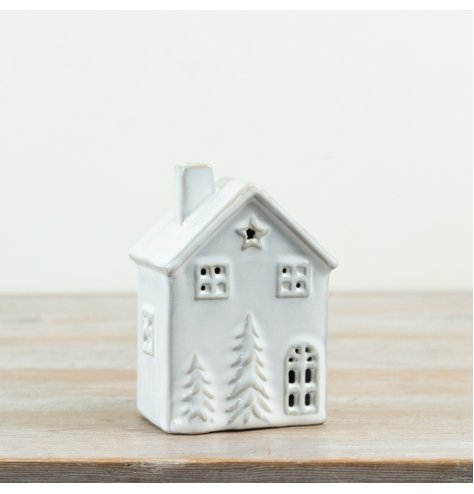 Delightful 13cm porcelain LED house emitting a cozy warm light, operated by three LR44 batteries.