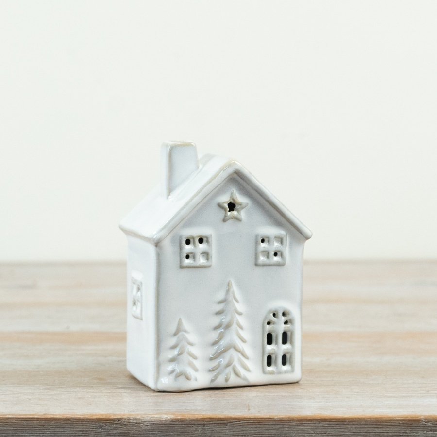 Delightful 13cm porcelain LED house, radiating a cozy glow, runs on three LR44 batteries.
