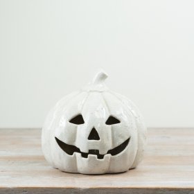 Enhance your Halloween decor with this charming terracotta pumpkin, perfect for autumn vibes.