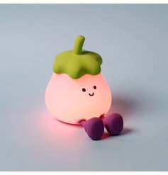 The Foodiemals Egg Plant LED Night Light doubles as a warm bedside lamp and a convenient phone holder.