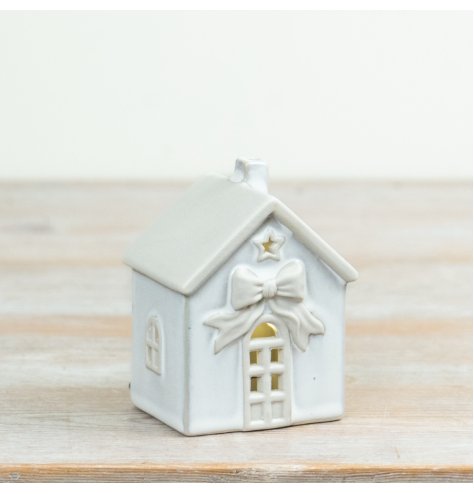 Illuminate festive decor with this elegant White LED Ceramic House for a subtle, charming glow.