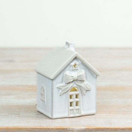 Illuminate festive decor with this elegant White LED Ceramic House for a subtle, charming glow.