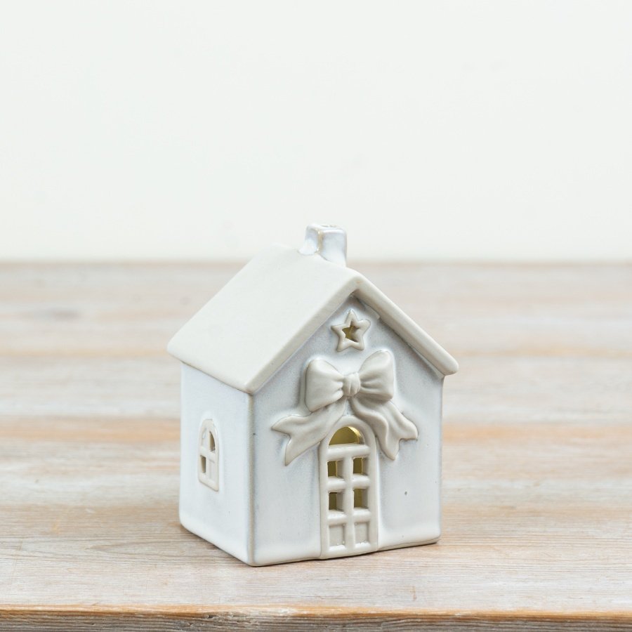 Bring a soft festive glow to seasonal collections with this charming LED Ceramic House Decoration.