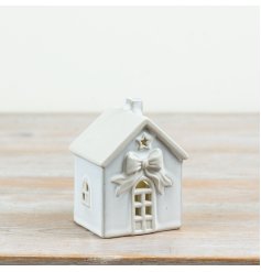 Illuminate your festive decor with this elegant White LED Ceramic House for a soft, charming glow.