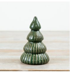 Finished in a vibrant green glaze with raised ribbed detailing