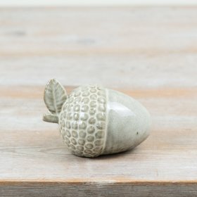 Bring a touch of nature indoors with this intricately designed Acorn Decoration.