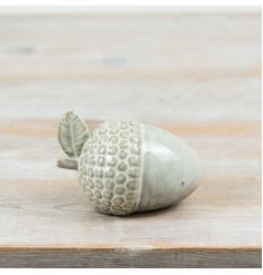 Bring rustic charm to your space with this intricately crafted Acorn Decoration.