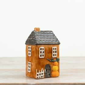Bring warm autumn vibes with our charming Pumpkin Candle House.