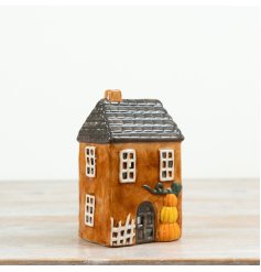 Create warm autumn vibes with our delightful Pumpkin Candle House.
