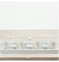 Ceramic candle holder featuring decorative Christmas tree shapes along a rectangular base.