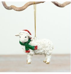 Charming polyresin sheep adorned with festive red Santa hat and white scarf for your Christmas tree