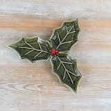 Ceramic holly leaf dish with a three-leaf sculptural shape and intricate vein details.
