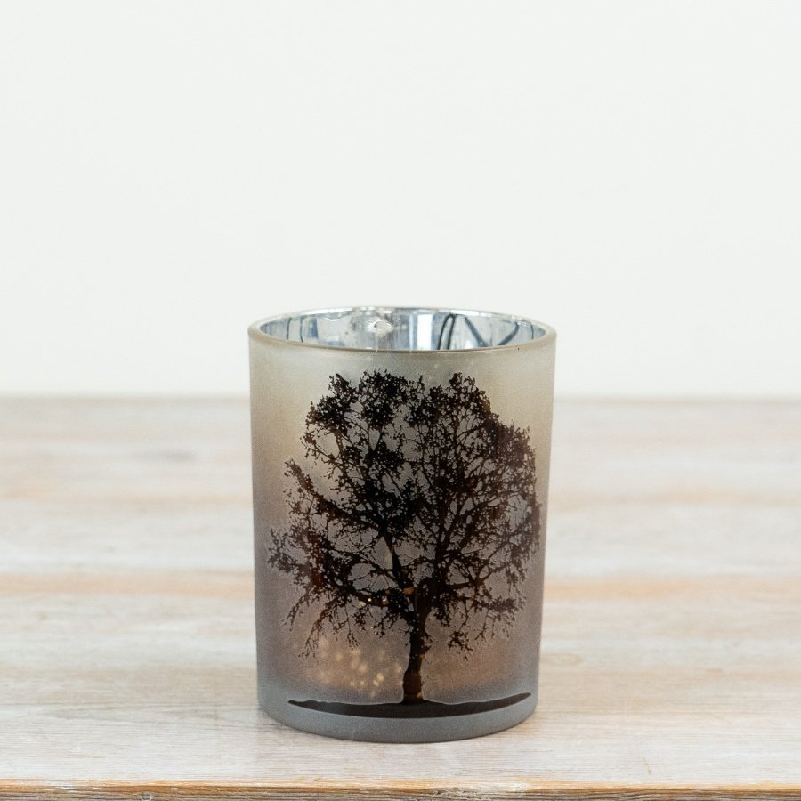 Create a soft, ambient glow with this beautifully finished frosted glass t-light holder