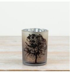 Add a warm, atmospheric glow to seasonal and year-round interiors with this elegant frosted glass t-light holder.