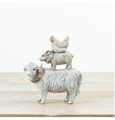 A delightful stacked ornament featuring farm animals for the festive season