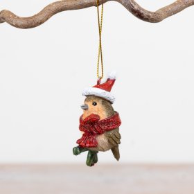 Delightful robin wearing a festive red Santa hat and snug scarf