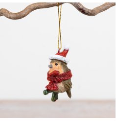 Delightful robin wearing a festive red Santa hat and scarf
