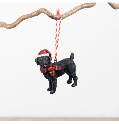 Endearing black dog ornament with cosy scarf and Santa hat, ideal for your festive tree