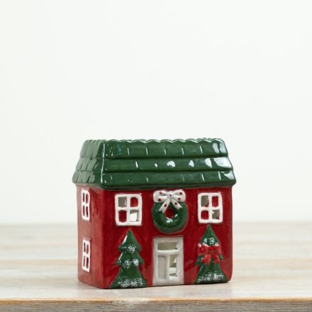 Bring a warm festive glow to Christmas displays with this charming house-shaped tealight holder. 