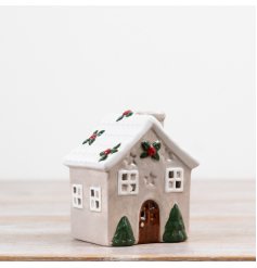 Bring charm to your space with this stylish Dolomite candle house.