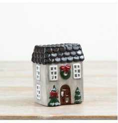 A delightful candle house in grey and red with a glossy glaze finish.