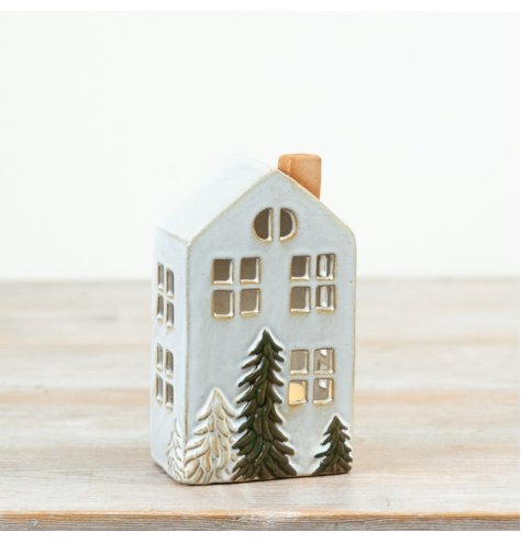 Bring warm seasonal vibes to your space with this ceramic t-light holder house ornament.