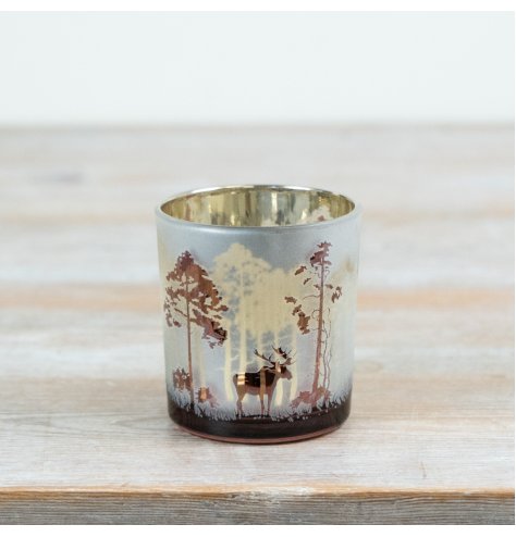 Add a touch of woodland serenity to your seasonal decor with this Frosted Forest T-light Holder.