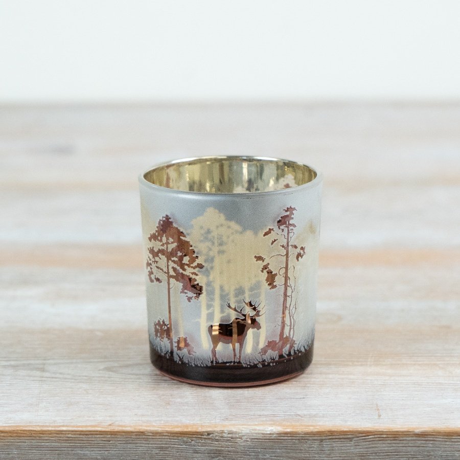 Featuring a beautifully detailed forest scene with silhouetted trees and a central stag motif