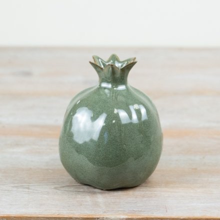 Elevate your decor with this chic ceramic pomegranate, adding stylish and elegant charm to any space.